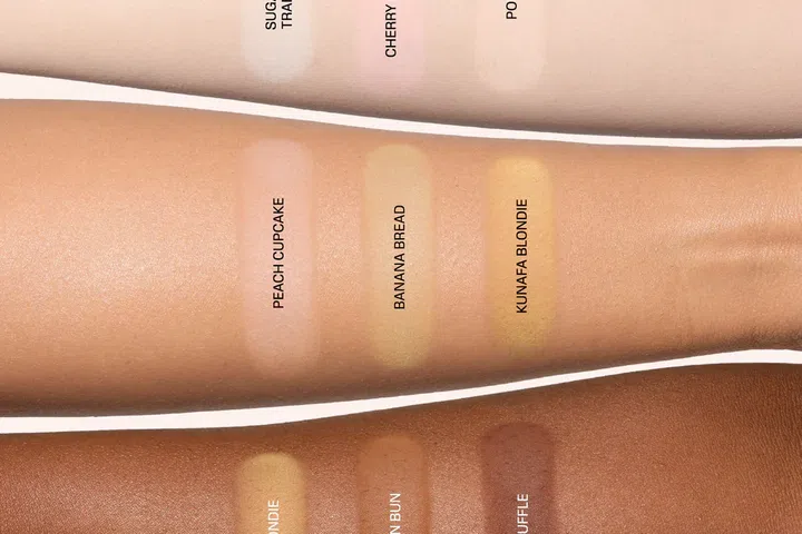 Huda Beauty easy bake pressed powder phone grip swatches on light to medium to dark skin tones