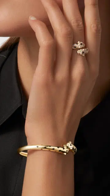 Model wearing Cartier Panthere ring and bracelet