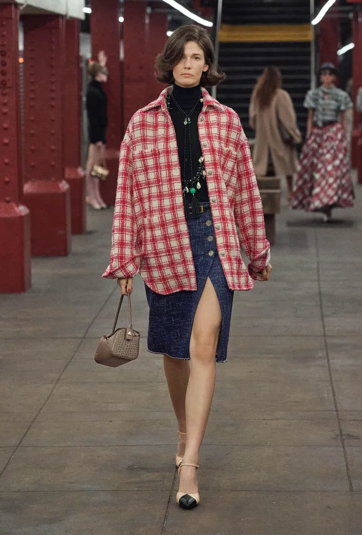 Chanel Metier d’Art 2026 - lumberjack wool shirt and dark blue midi skirt
