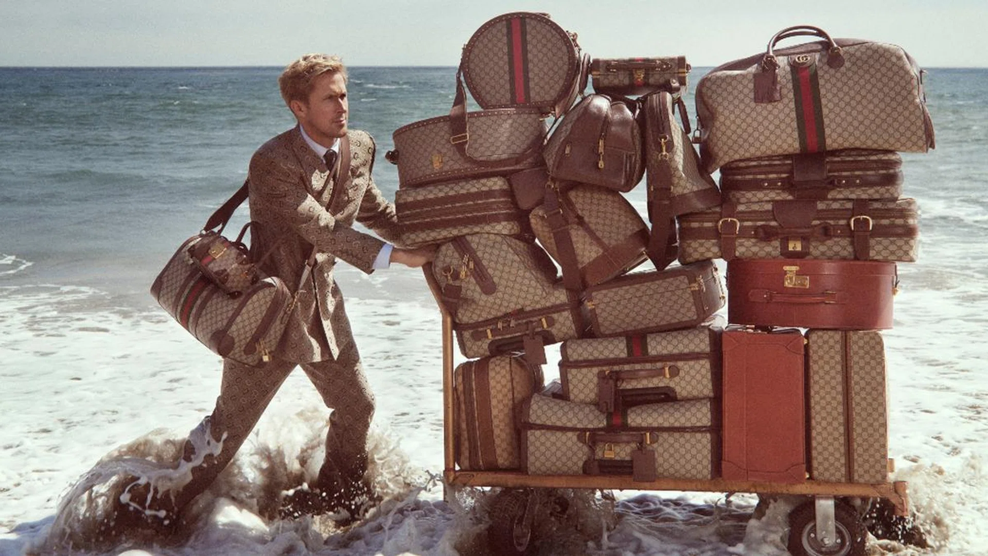 Ryan Gosling rolls in with a new campaign for the Gucci Savoy travel collection. Credit: Gucci