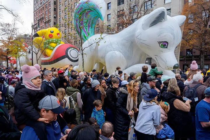 NEW YORK, NEW YORK - NOVEMBER 26: Crowds gather to watch Macy's Balloon Inflation 2025 on November 26, 2025 in New York City. This year will be the 99th annual marching of the Macy's Thanksgiving Day Parade, and will feature a new Mario and Buzz Lightyear balloons and a LABUBU float, among others. (Photo by Adam Gray/Getty Images)