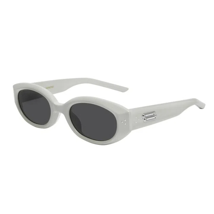 A pair of white Gentle Monster sunglasses