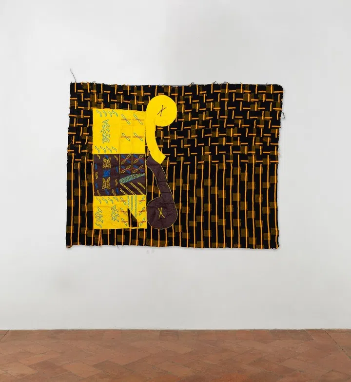 Weathered jute sacks and colorful fabric scraps in Ibrahim Mahama’s Digging Stars, Singapore Art Week.