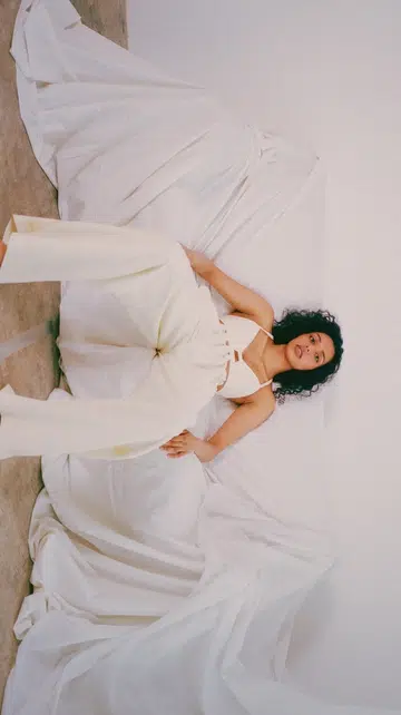 A model lounging on a couch