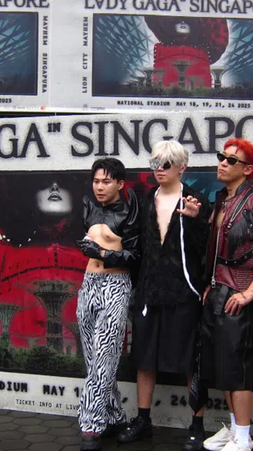 Lady Gaga fans posing for pictures at her Mayhem Concerts in singapore
