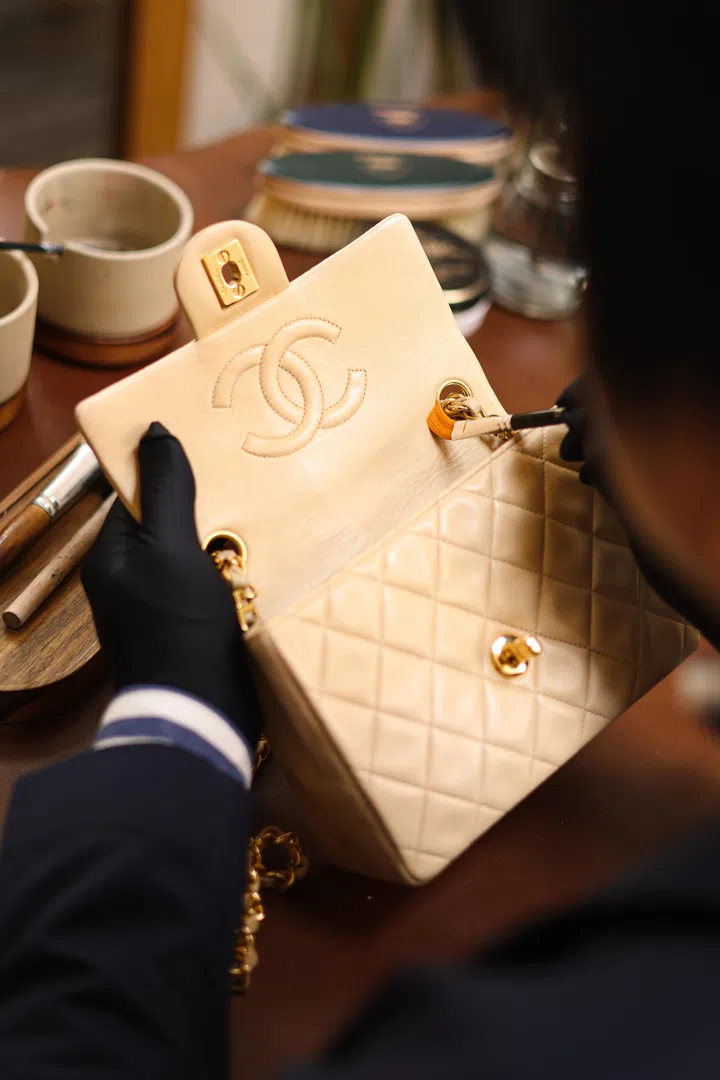 Artisans restoring a Chanel leather bag at Margo & Smith