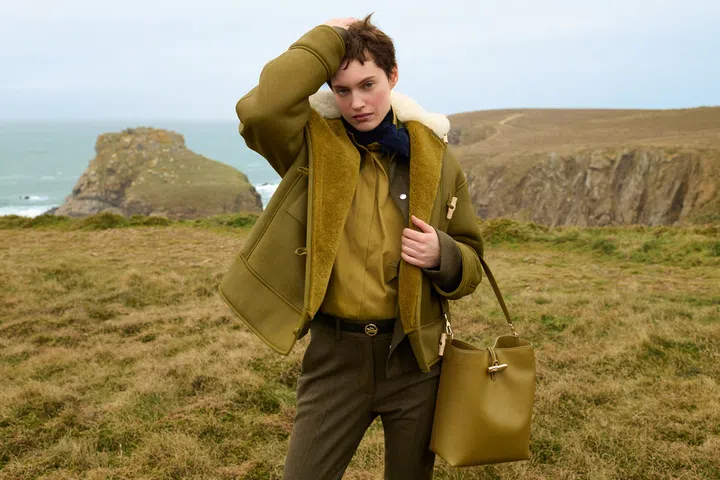 le roseau m hobo handbag in olive paired with shearing collared toggle coat from longchamp winter 2025 collection 