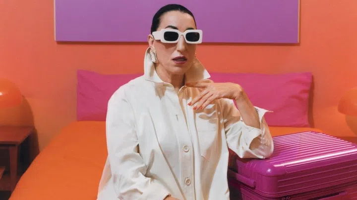 Rimowa orange and magenta luggage