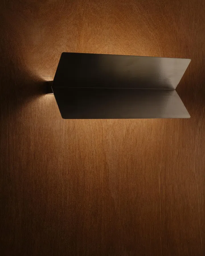 Metal lamp shades that’s repurposed from steel claddings left behind by the previous tenant. Credit: Khoo Guo Jie