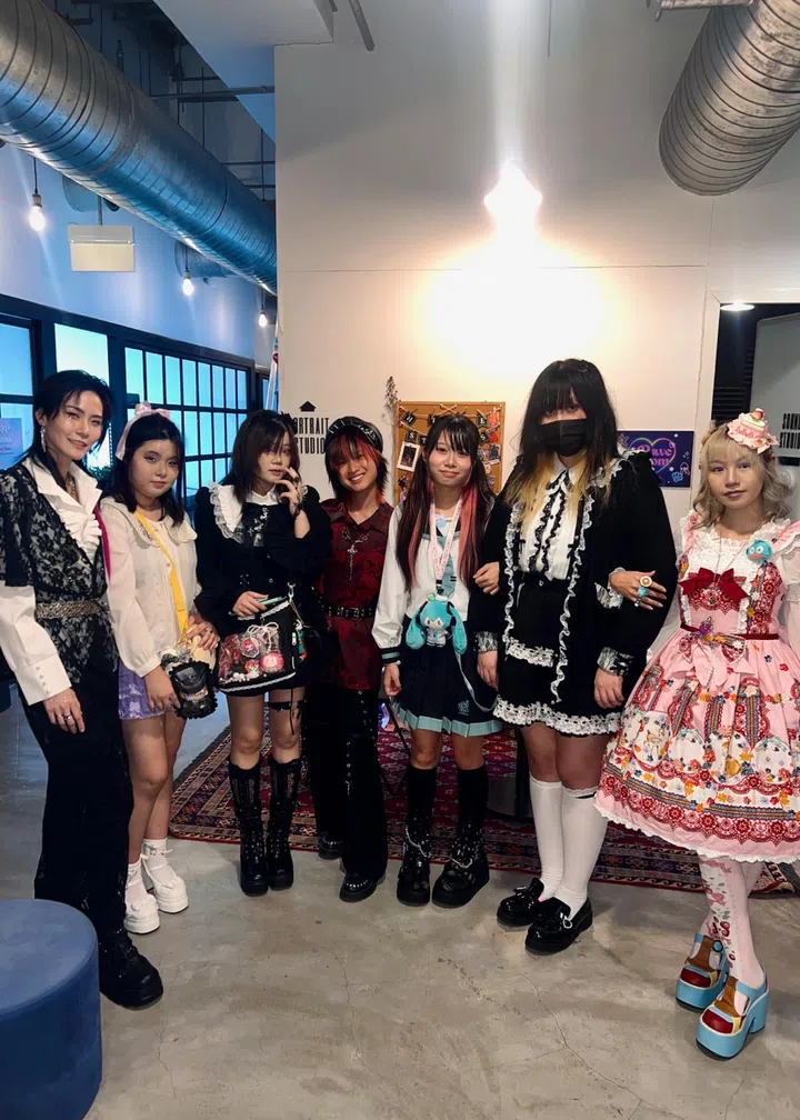 Group photo of Konbini Singapore visitors dressed in various J-fashion styles, including Lolita and Visual Kei — representing the diversity of Harajuku street culture