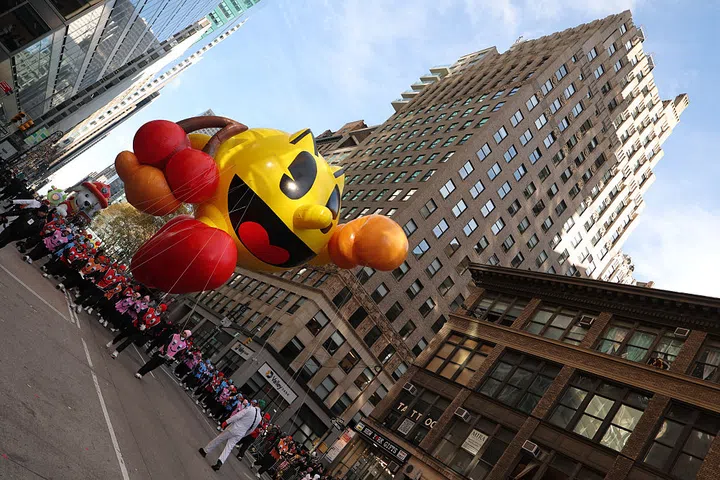 NEW YORK, NEW YORK - NOVEMBER 27: The PAC-MAN balloon floats the route during 2025 Macy's Thanksgiving Day Parade on November 27, 2025 in New York City. (Photo by Michael Loccisano/Getty Images)