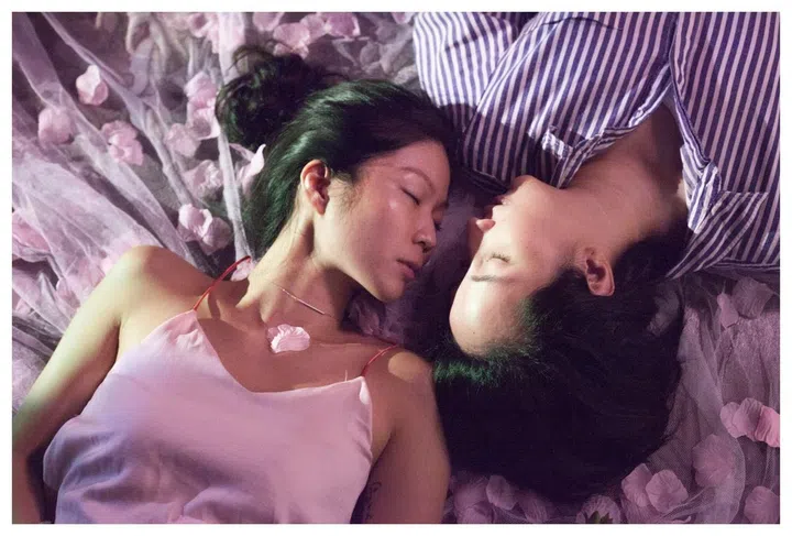 Ele and Lee lie facing each other. The two don't prioritise official marriage, although they do see themselves in a long-term partnership, and imagine a life together outside of Singapore. They do not consider gender roles important in their relationship, which they see as egalitarian. 2018.