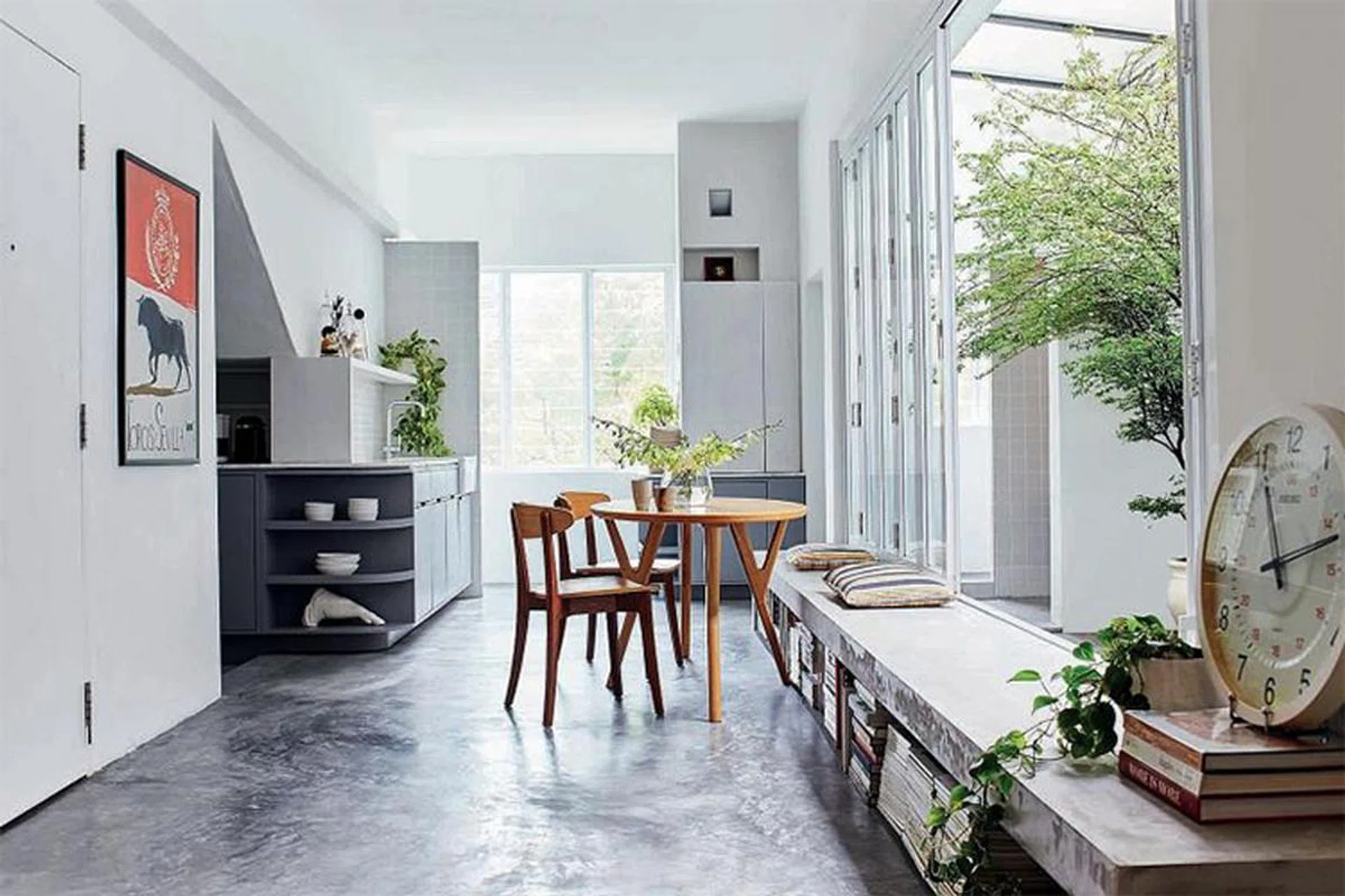 Concrete ledges double as seating (above) in the shophouse home of Mr Cheah Wei Chun.