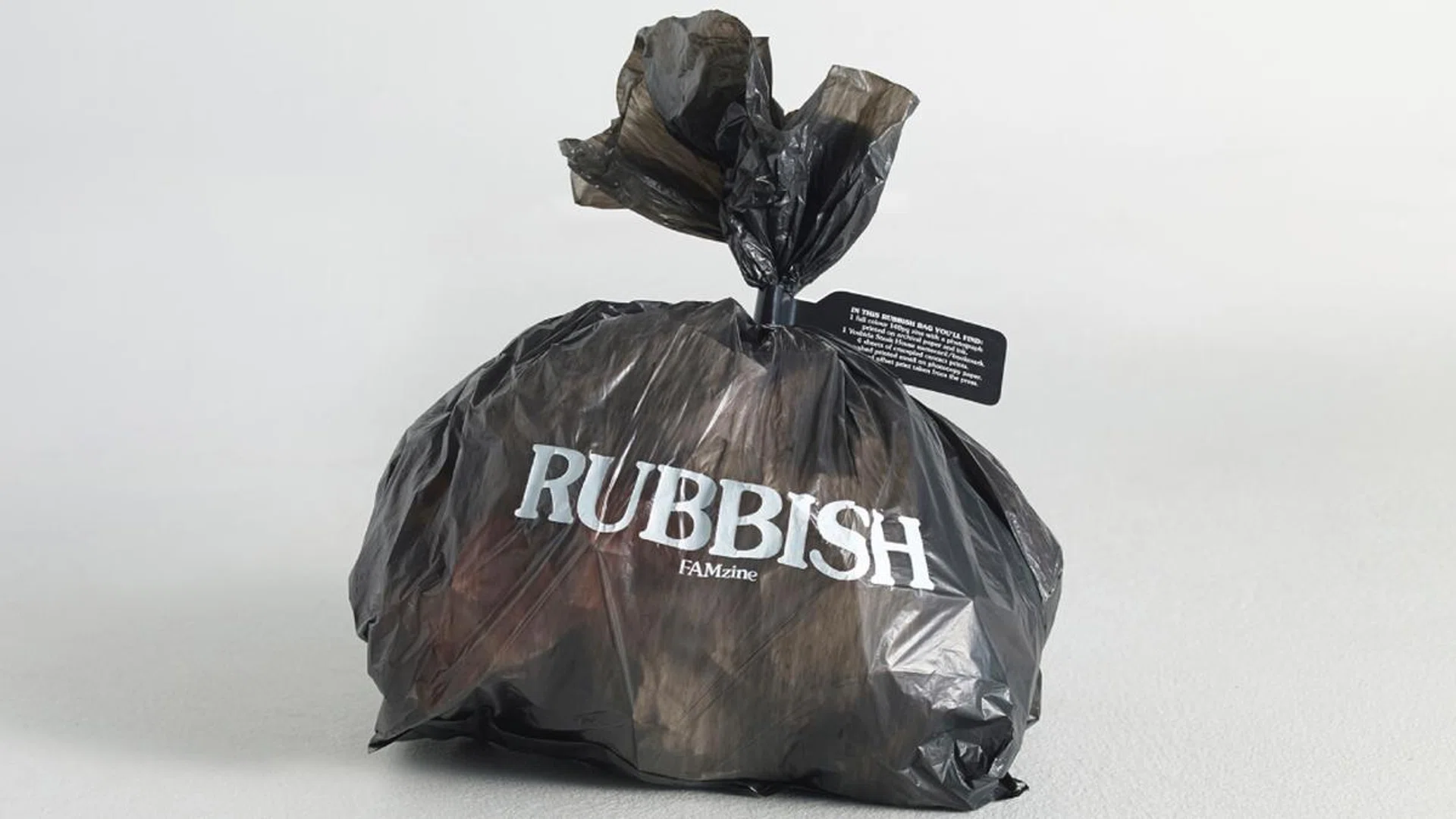 Rubbish Famzine debuted in 2013 by Holycrap.sg – the art collective Pann Lim formed with his wife Claire and two children Renn and Aira – every edition of this hand‐finished publication has become a collector’s item for its unexpected take on a family album, right down to the format. Here, is the first issue, which came packaged in a trash bag. Credit: Pann Lim