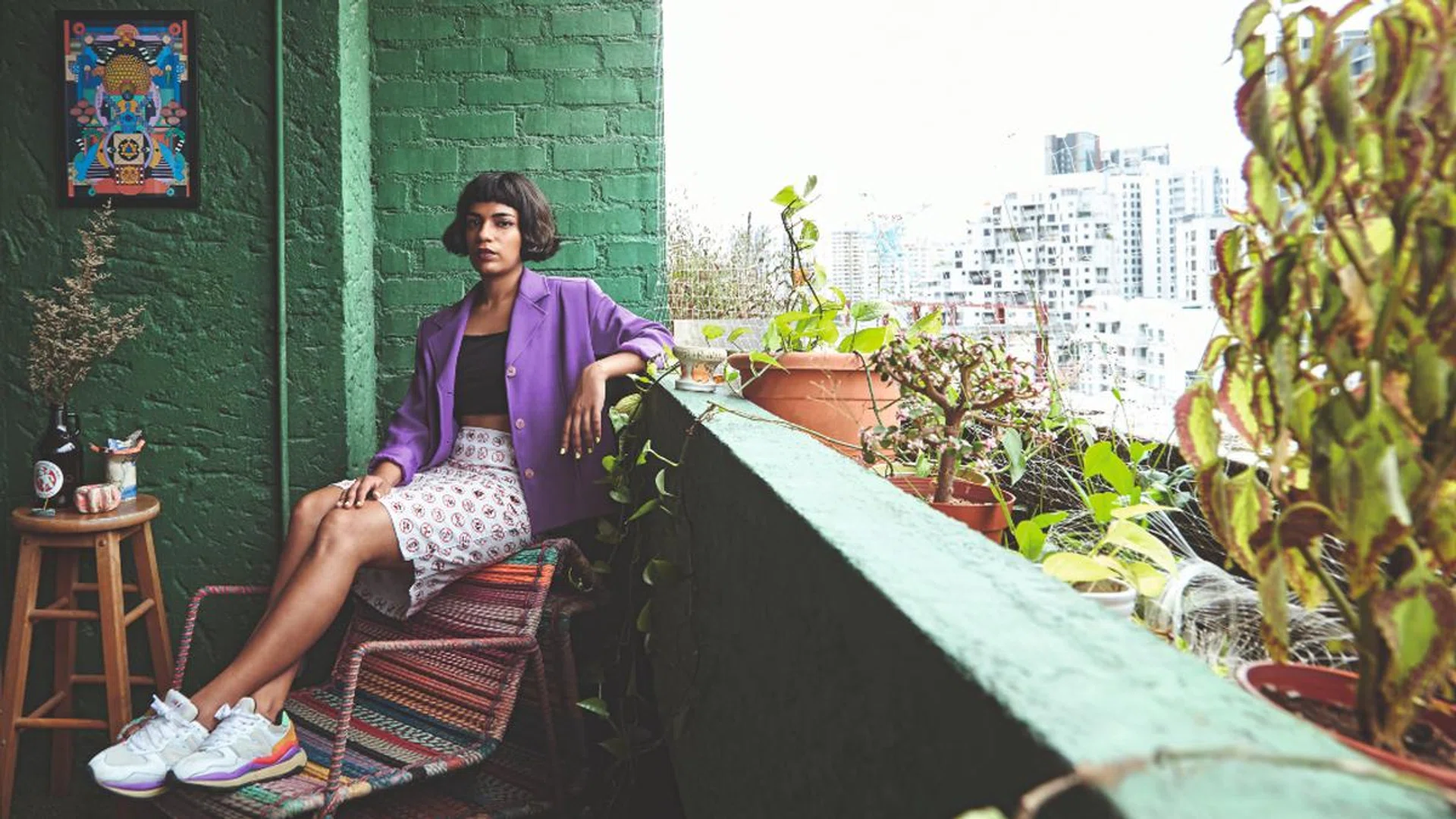 The artists whom Tulika Ahuja works with tend to engage in social commentary with a sense of humour, including the artist Reza Hasni whose psychedelic work hangs on the wall here. Credit: Phyllicia Wang