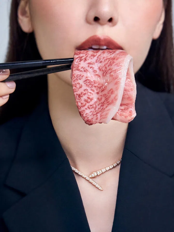 A model eating wagyu beef 