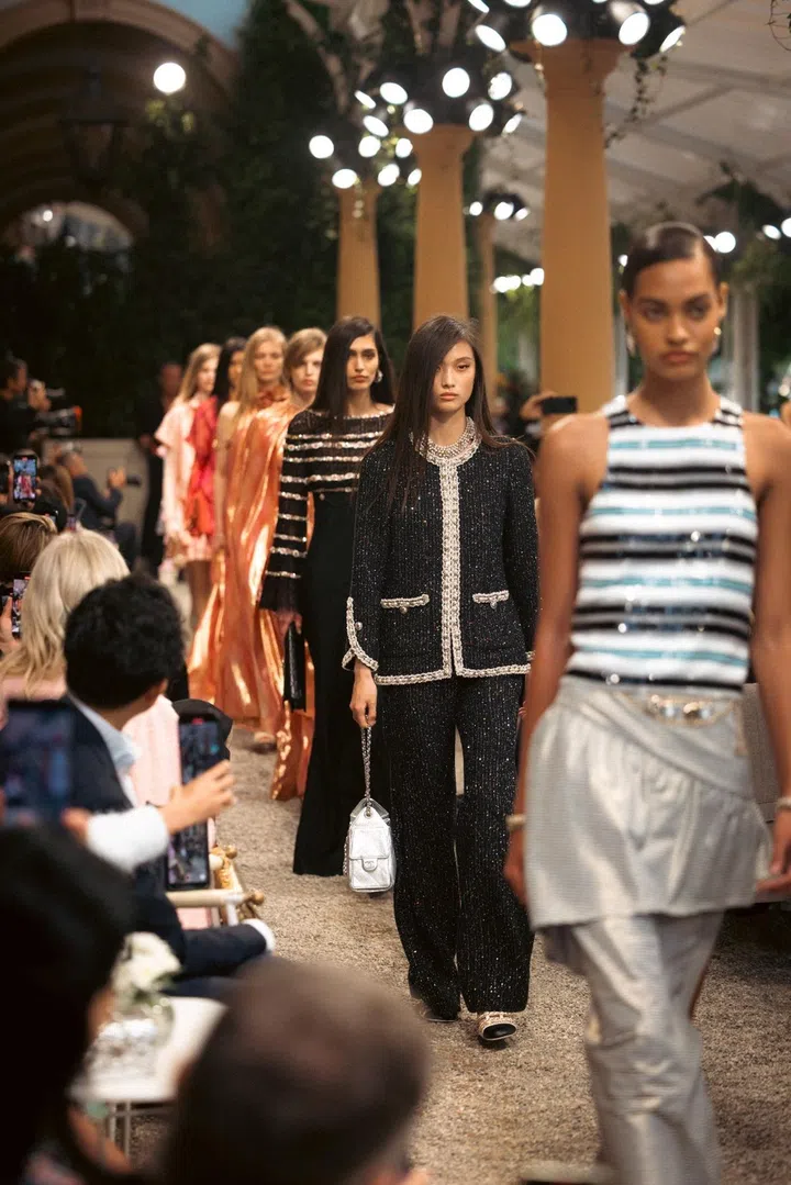 Models in looks subtly inspired by dance and disco for Chanel Cruise 2025/26