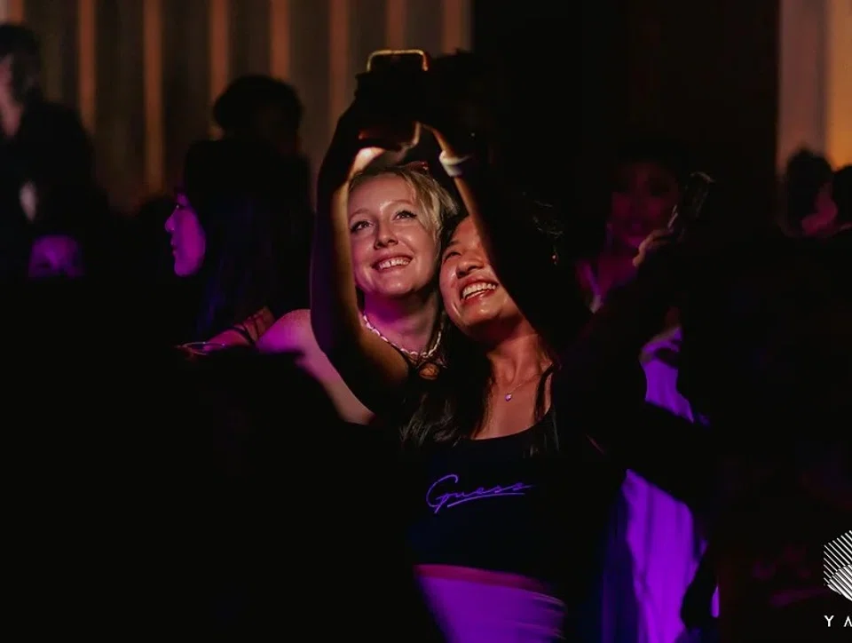 Daisy Anne Mitchell poses with a fan