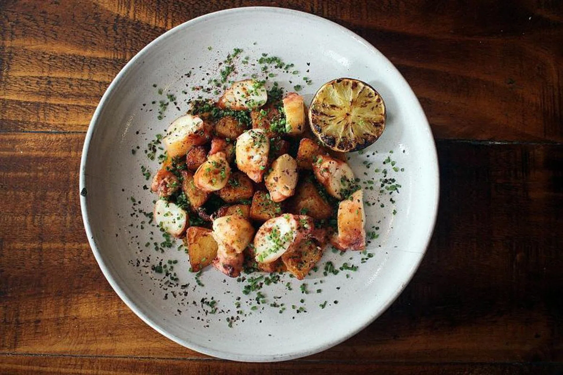 Octopus, fried potatoes, red pepper puree and paprika by Moosehead Kitchen-bar. Photo: Moosehead Kitchen-Bar
