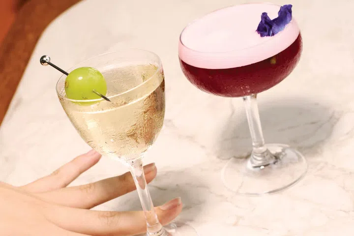 Cocktails at LAVO Marina Bay Sands rooftop restaurant in Singapore, including the Capri Martini and Voilà Viola