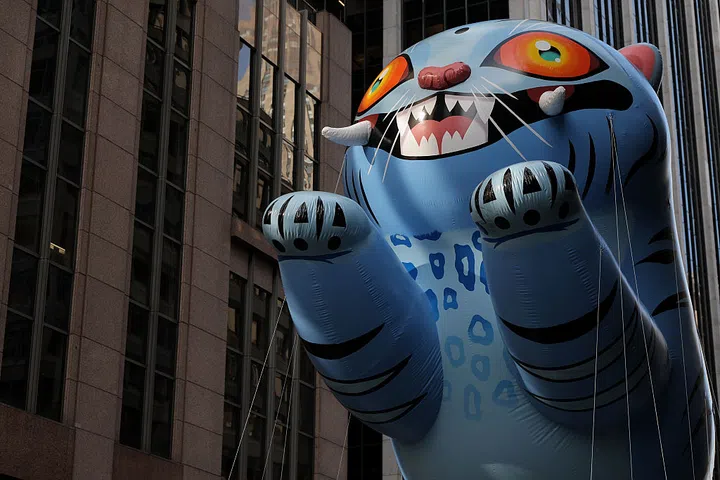 NEW YORK, NEW YORK - NOVEMBER 27: The Derpy Tiger balloon floats the route during 2025 Macy's Thanksgiving Day Parade on November 27, 2025 in New York City. (Photo by Michael Loccisano/Getty Images)