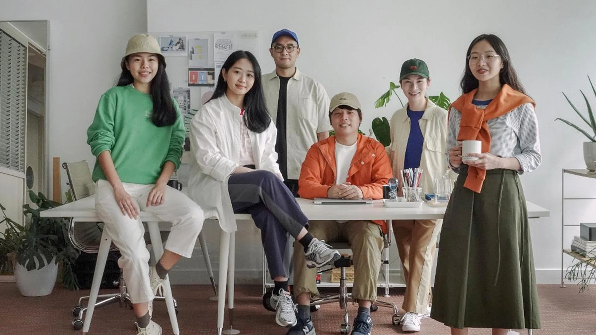 Meet the crew: Beyond The Vines founders Daniel Chew (in orange parka) and Rebecca Ting (in green cap) and their team, all decked out in the brand’s latestcollection, In Plain Sight, which was designed with architectural and design principles in mind and includes menswear for the first time. Credit: Courtesy
