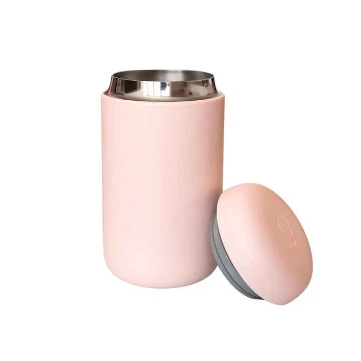 A pink Fellow Carter travel mug