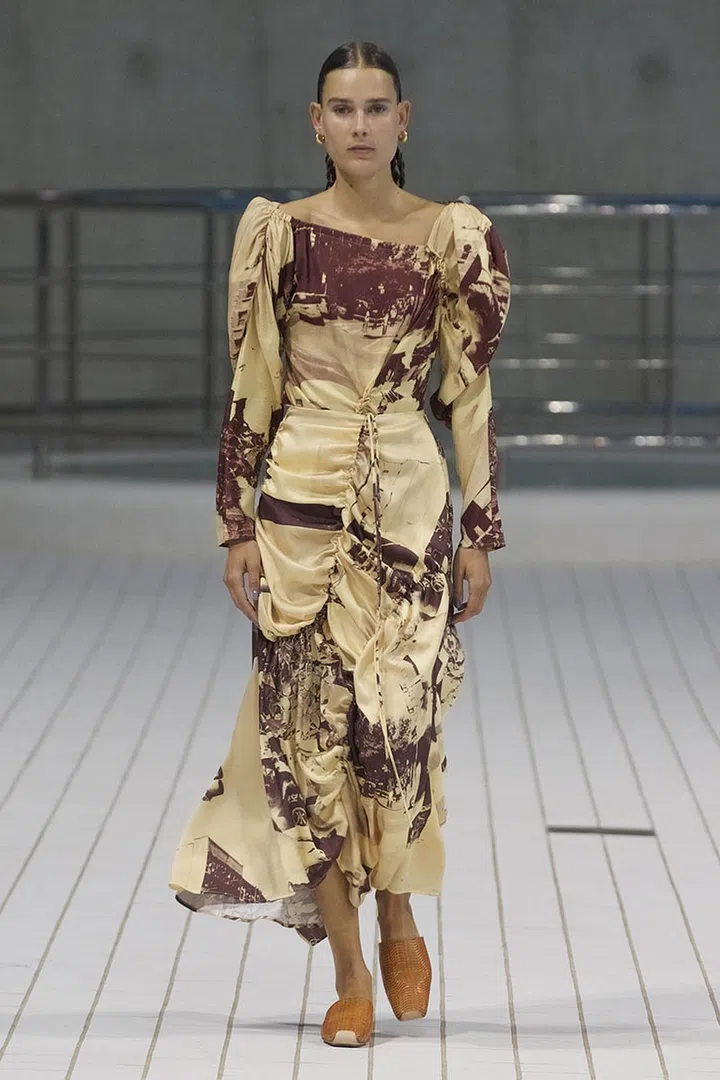 A model walking on runway wearing Rejina Pyo Spring Summer 2022 Women Ready to Wear Fashion Show on September 2021 in London, UK