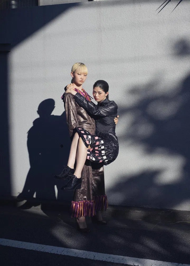 Japanese photographer Osamu Yokonami models carrying each other