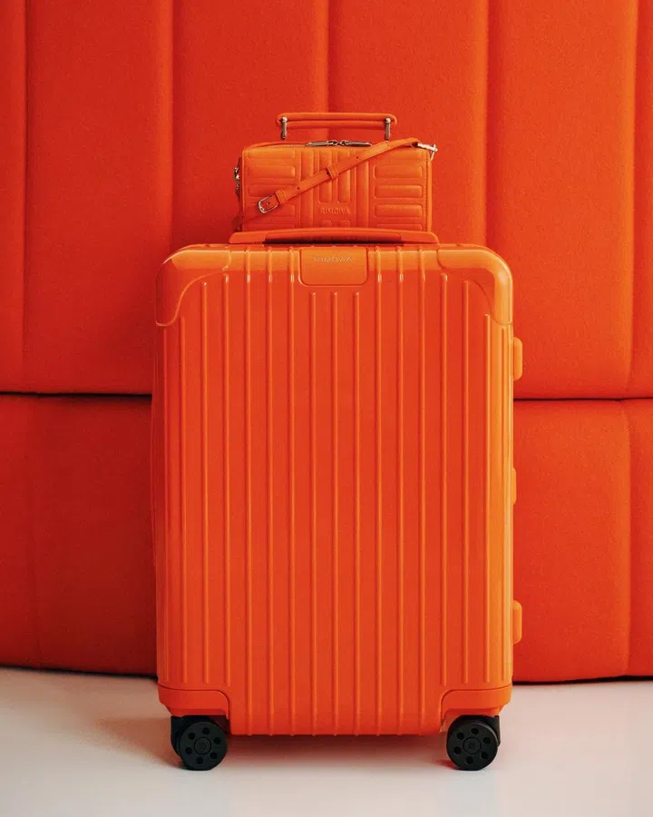 Rimowa orange and magenta luggage