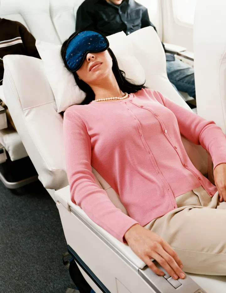 Woman Sleeping on Plane