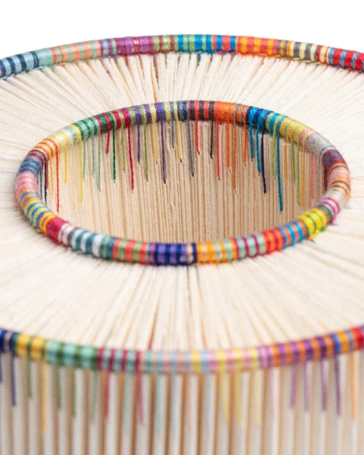 Close-up of “Endless” by Singaporean bookbinder Adelene Koh, a finalist for the LOEWE Foundation Craft Prize 2026, featuring a circular ash wood and copper wire column structure