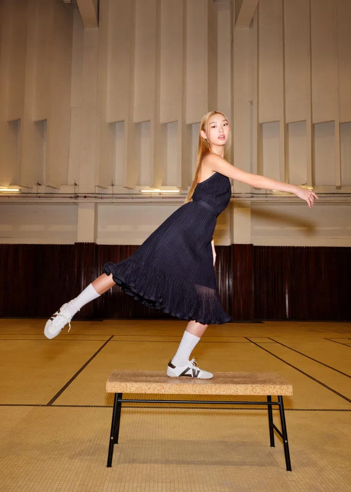 Ally Teo wearing Louis Vuitton Sneakerina sneakers in a ballet-inspired pose