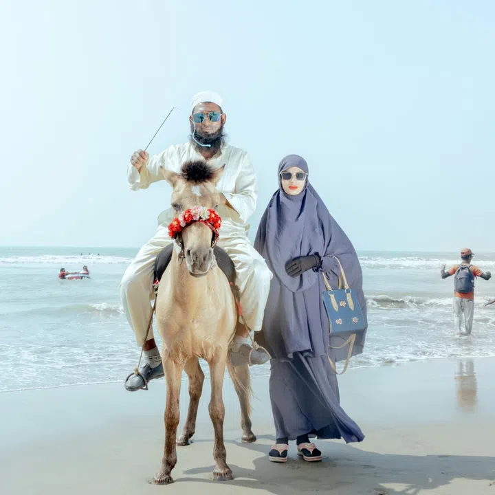 A couple poses for a picture at the Cox's Bazar Beach.