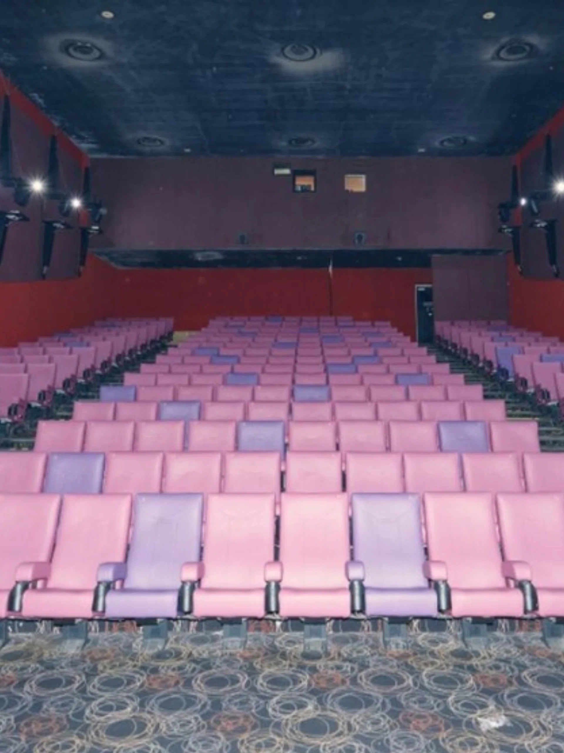 the projector’s pink seats at cineleisure
