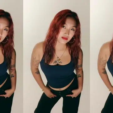 Bartender Erika Danielle for F ZINE Singapore, studio portrait with red hair and tattoos.