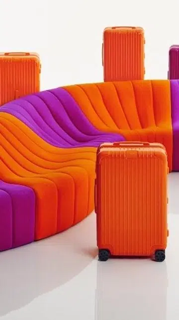 Rimowa orange and magenta luggage