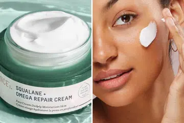 A model trying the Biossance Squalane cream