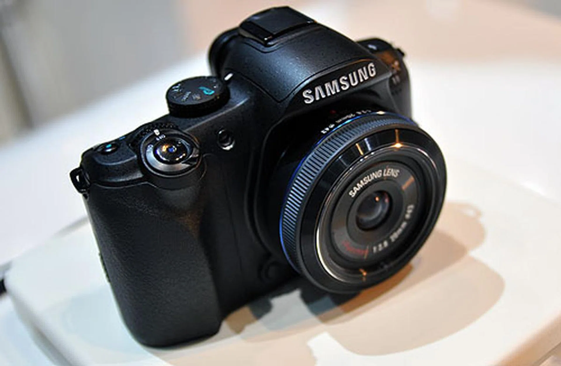 The Samsung NX11, which we've already spotted a few times, appears at the Samsung booths. The camera sports a mirrorless design and uses a 14.6-megapixel sensor, iFunction lens, 3.0-inch AMOLED display and HD movie recording.