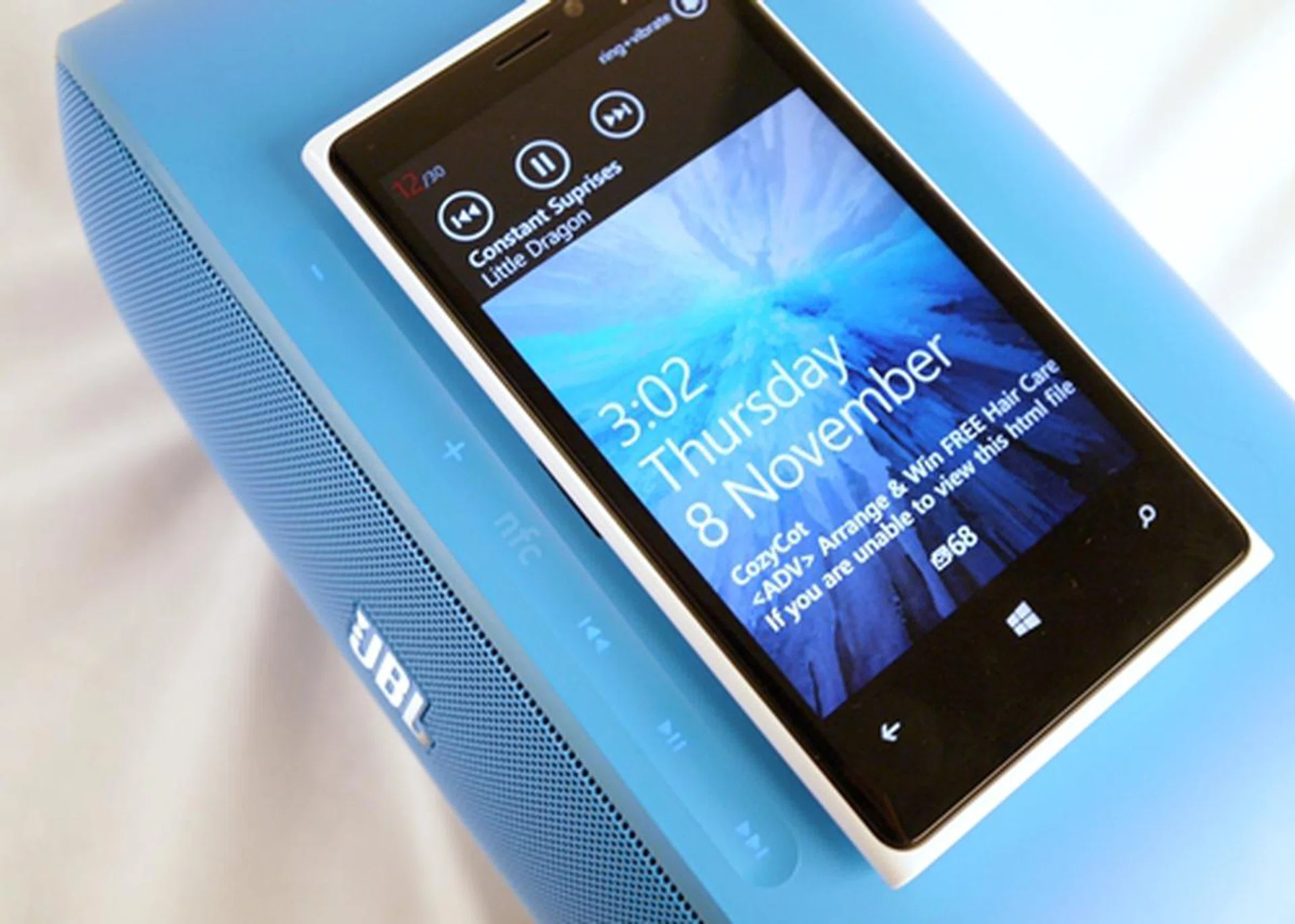 To pair your device, you either connect by tapping on "NFC" or via Bluetooth. Rest your phone on top of the device to charge it.