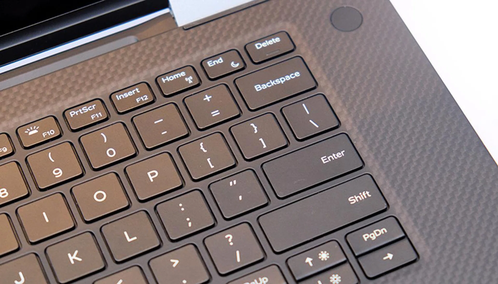 The key uses magnets in place of regular switches. However, it feels just like any other keyboard. Note also the black carbon fiber palm surrounds.