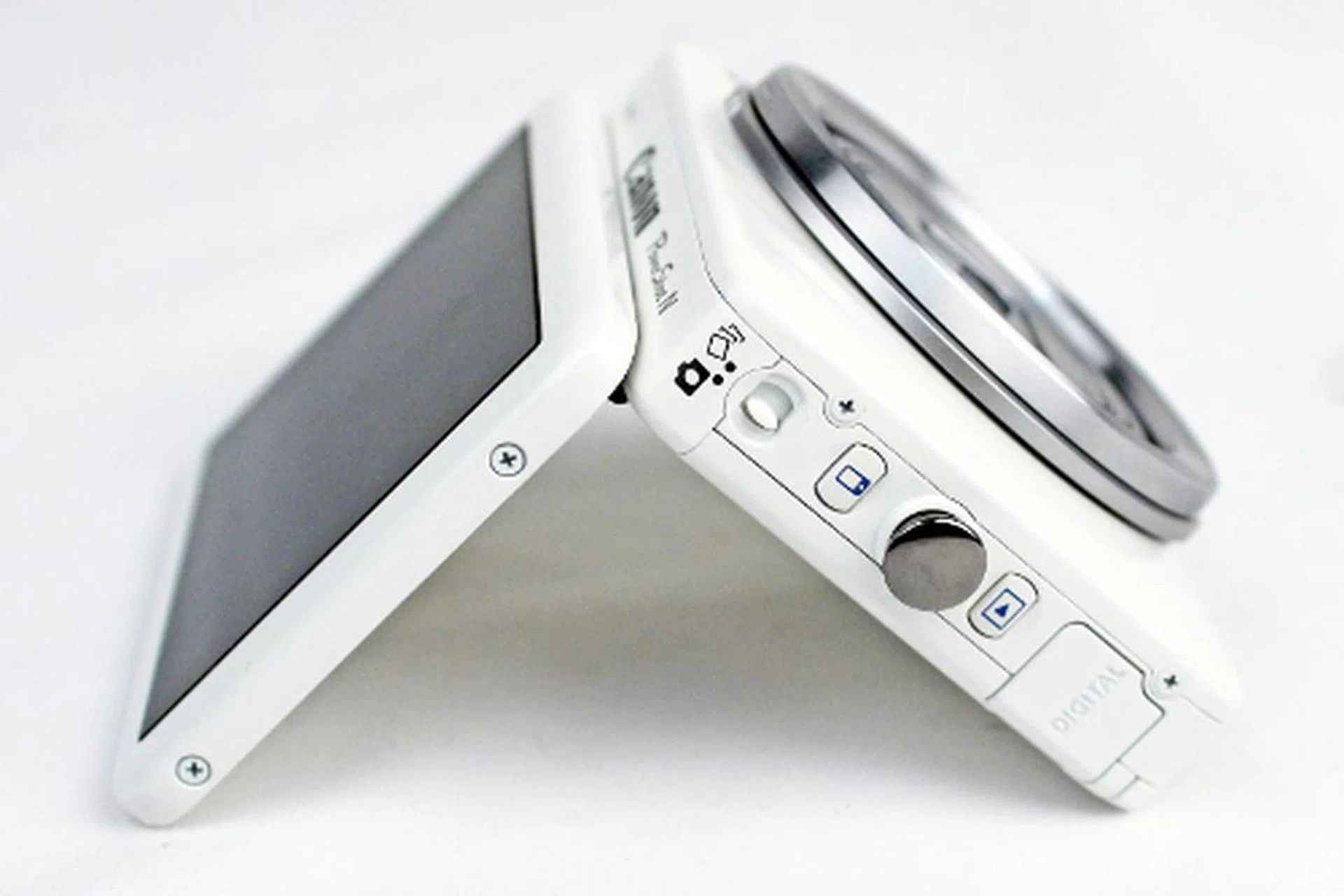 While the PowerShot N's display is able to tilt up 90 degrees, a pity it doesn't swing out sideways. On this side of the camera (right side) are the Creative Shot mode switch, Mobile Device Connect and Playback buttons. 