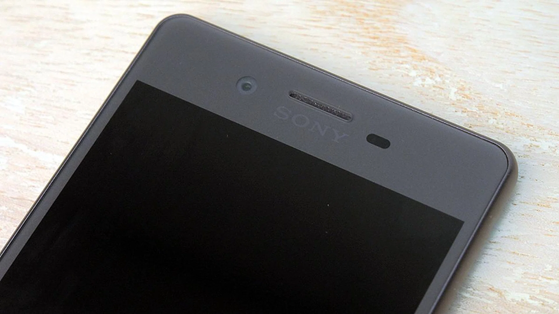 The phone's speakers are located at the receiver at the bottom, and the call audio speaker (pictured).