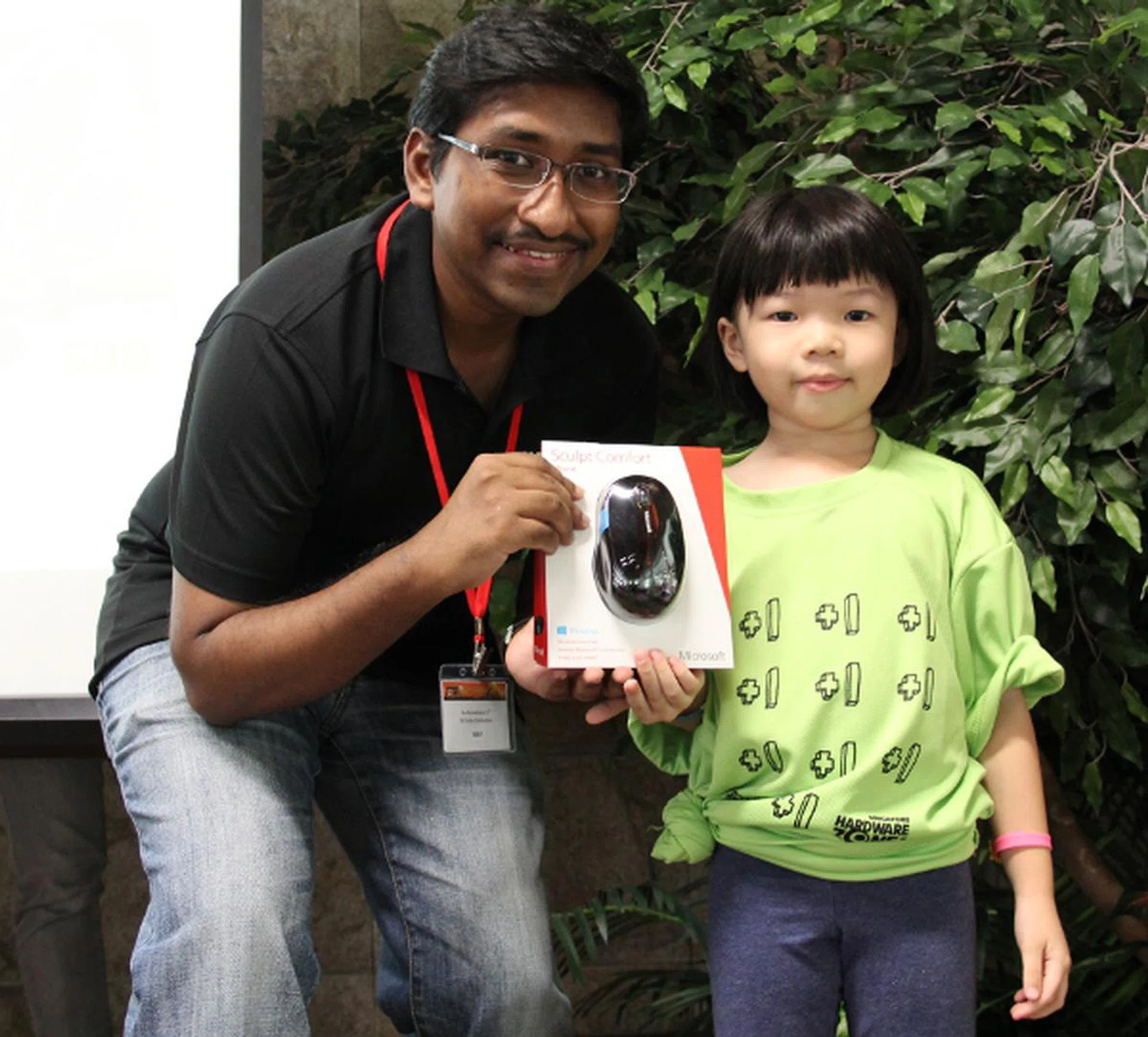 One of our younger lucky draw winners walked away with one of the five sets of Microsoft Sculpt Comfort Mouse. It'll come in handy when she surfs our forums.
