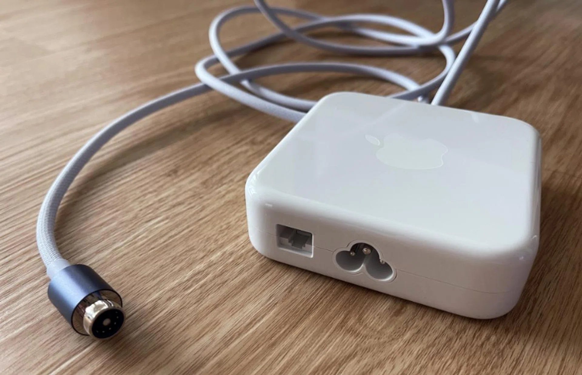 The Gigabit Ethernet port is located at the power adapter to help keep tables free of clutter. Note how the cord is purple.
