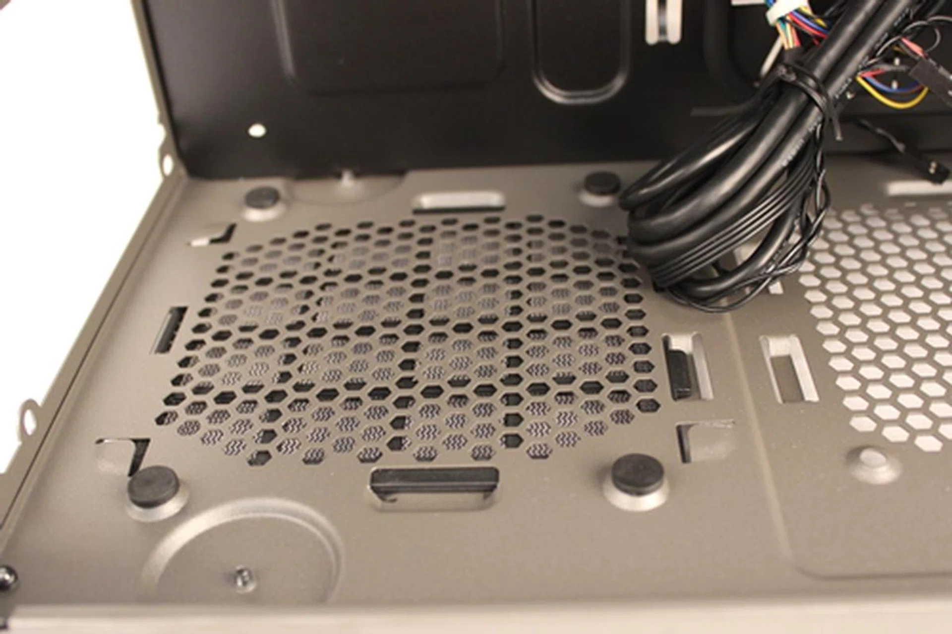 There are rubber stand-offs to provide some sound-dampening for the installed PSU.