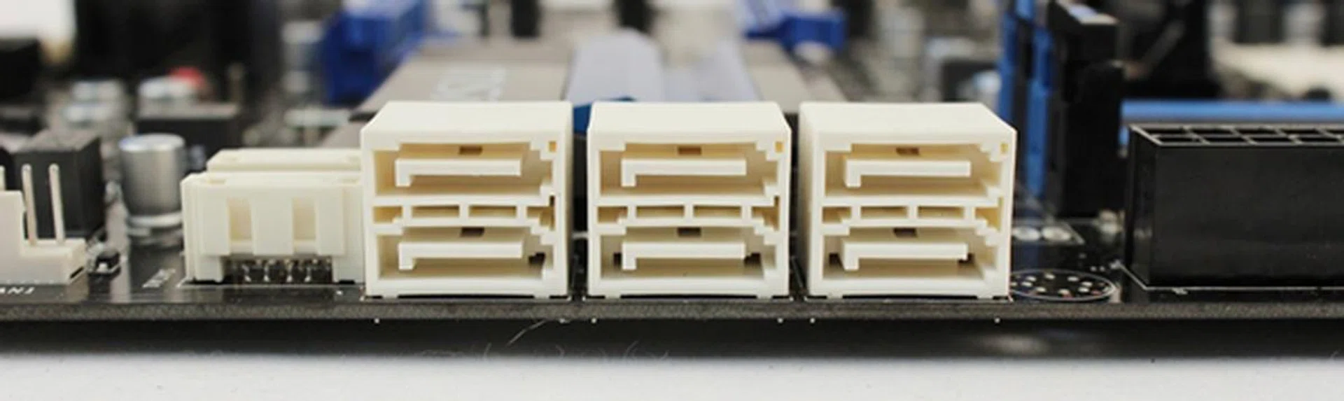 The six angled SATA 6Gbps connectors and to the left of them, a pair of vertical-facing ones. 