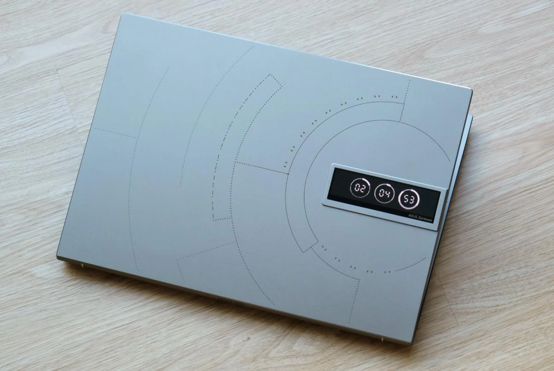 The cover features space-inspired motifs and a tiny customisable OLED display.