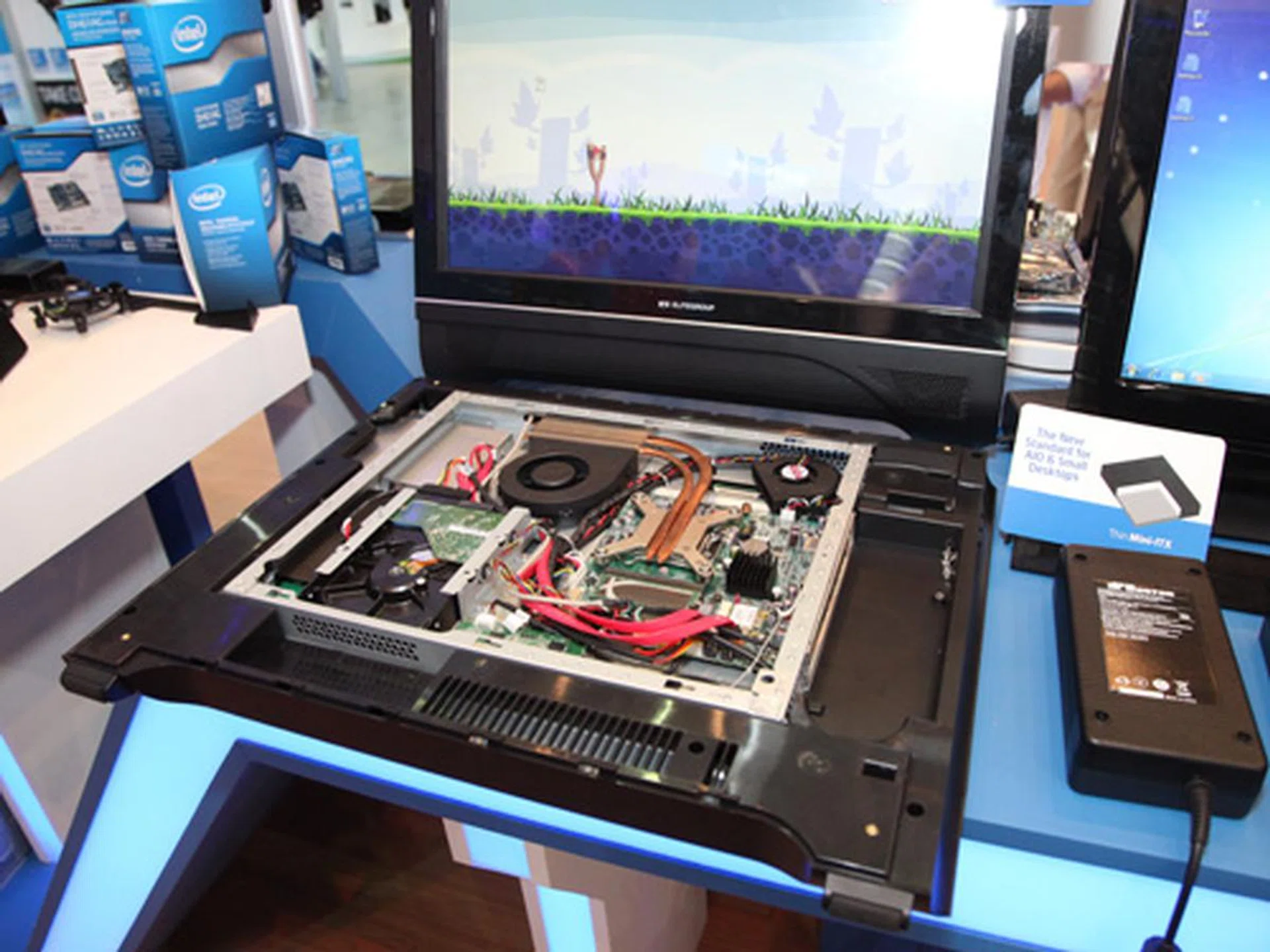 Here's another usage of the new Thin Mini-ITX form factor. OEMs will begin integrating this standard part into All-in-One PCs, enabling very highly configurable specifications, all the way to using a Core i7. Seen here is a sample from ECS. How about a DIY AIO PC, anyone?