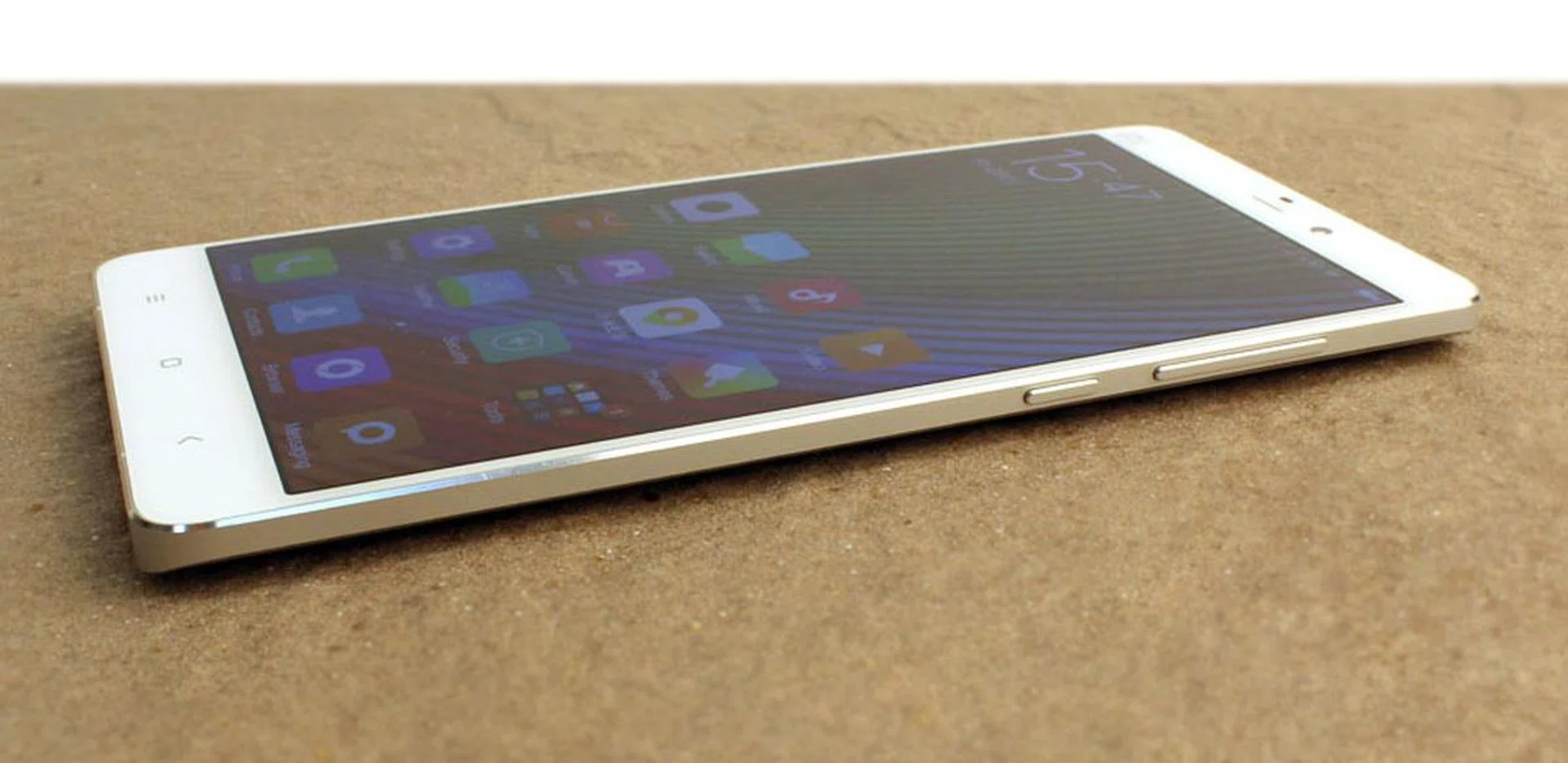 The Mi Note's skinny power button and volume rocker are easily within reach on the right side of the phone.